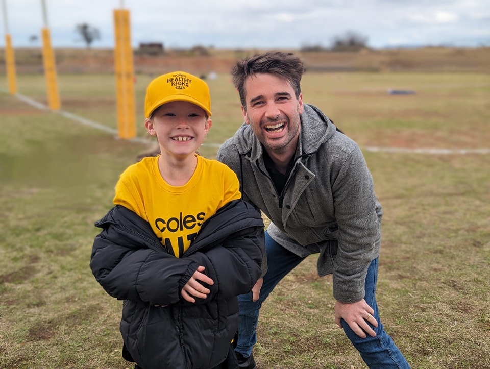 On the boundary with a young Coles Healthy Kicks player