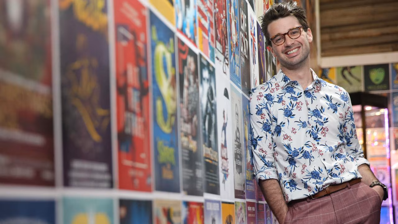 David Greenwood OAM at the CentreStage poster wall — fifteen years of Geelong productions